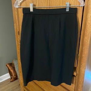 Black pinstriped pencil skirt. Size 4
